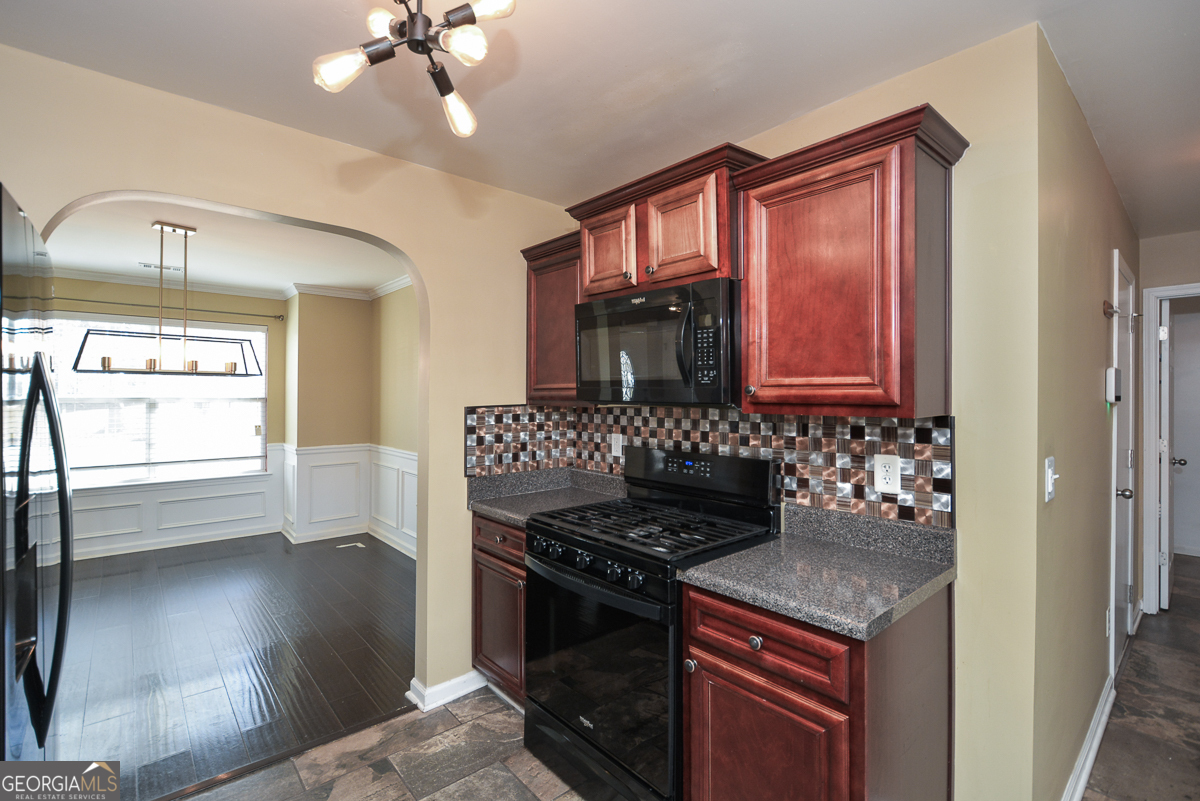 137 Baywood Crossing Hiram, GA 30141 - Photo 17 of 61 a kitchen with granite countertop a stove and a sink
