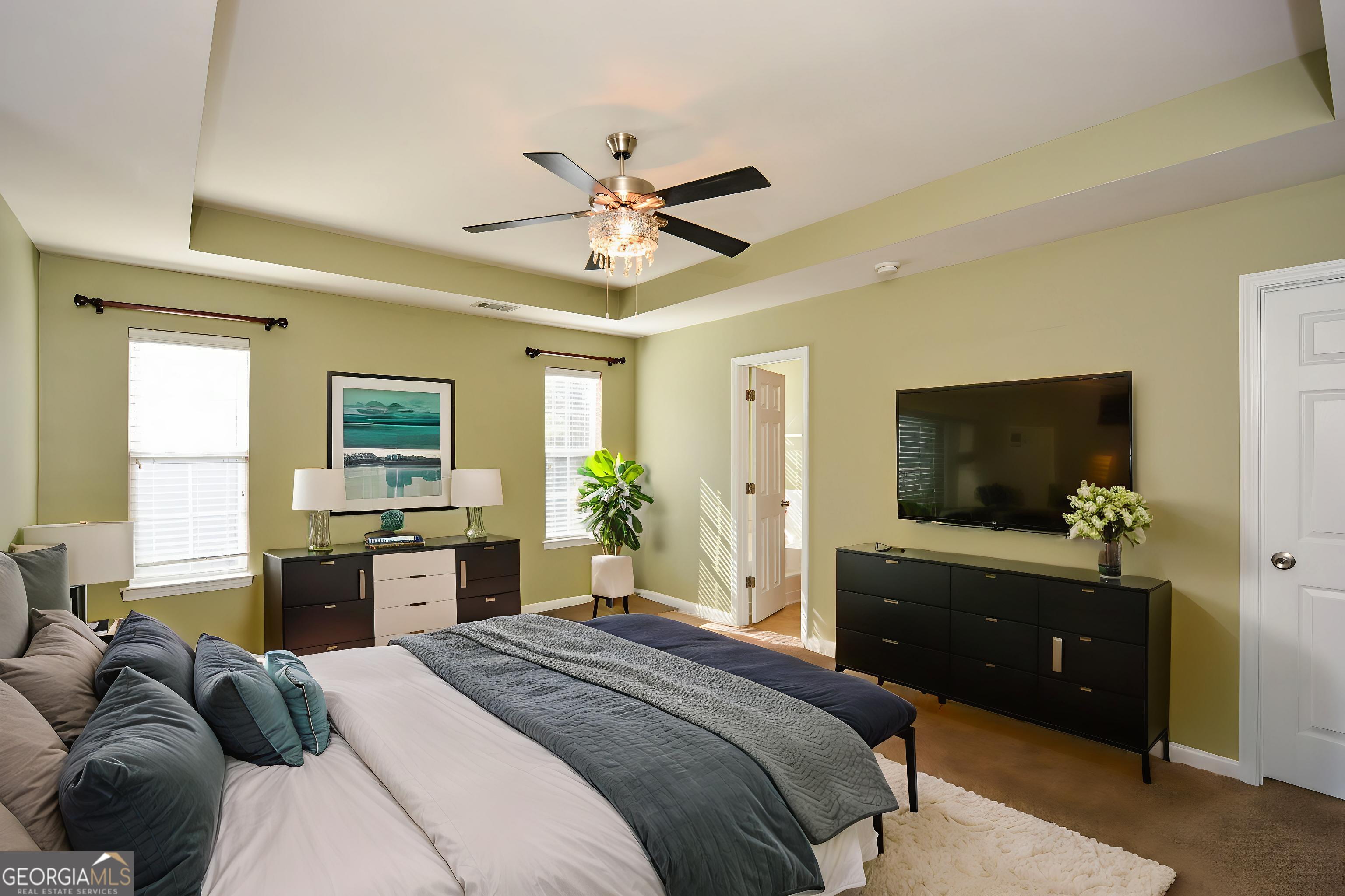 137 Baywood Crossing Hiram, GA 30141 - Photo 25 of 61 a bedroom with a bed and a flat screen tv