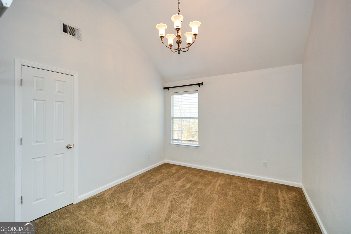 137 Baywood Crossing Hiram, GA 30141 - Photo 42 of 61 a view of a livingroom with a chandelier