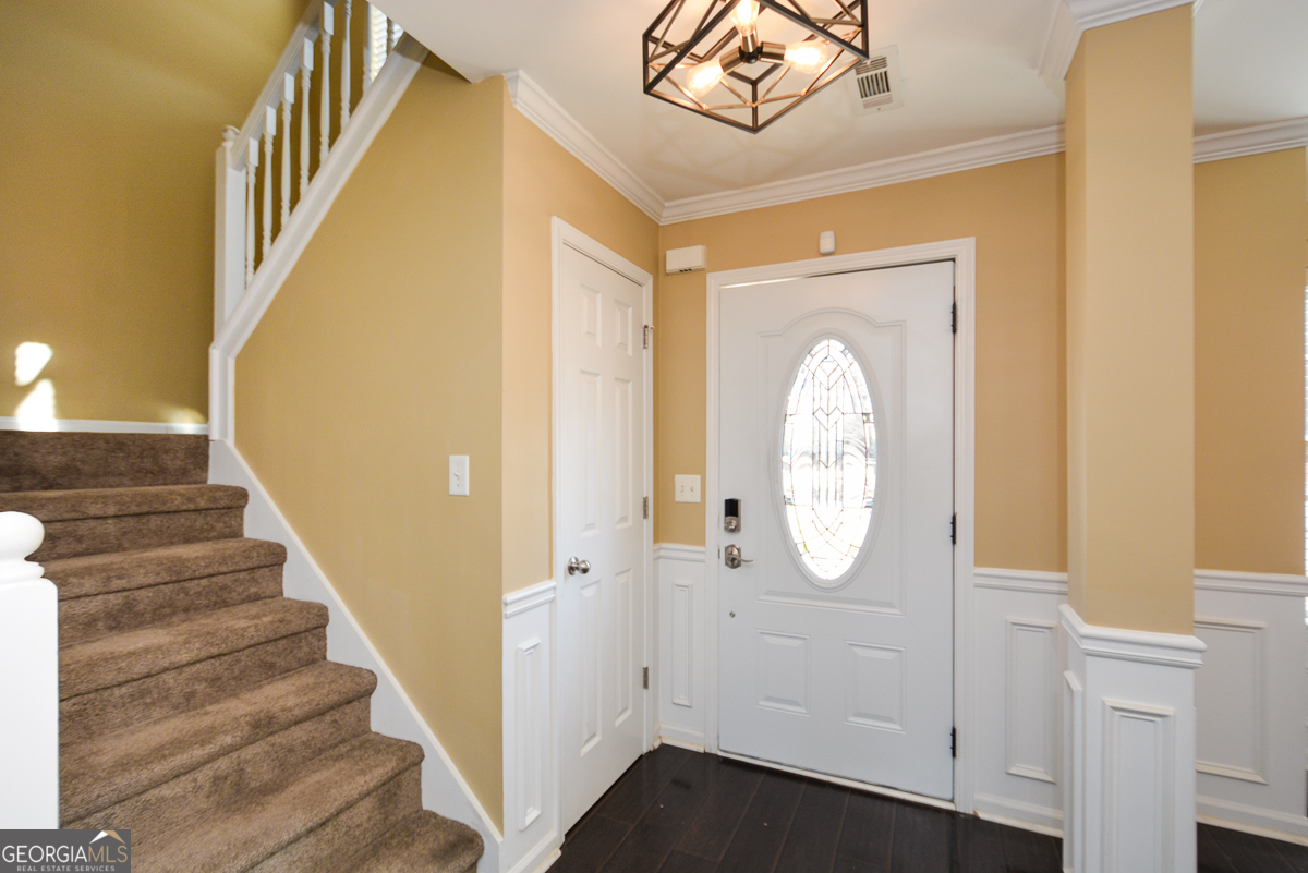 137 Baywood Crossing Hiram, GA 30141 - Photo 6 of 61 a view of a hallway with wooden floor and entryway