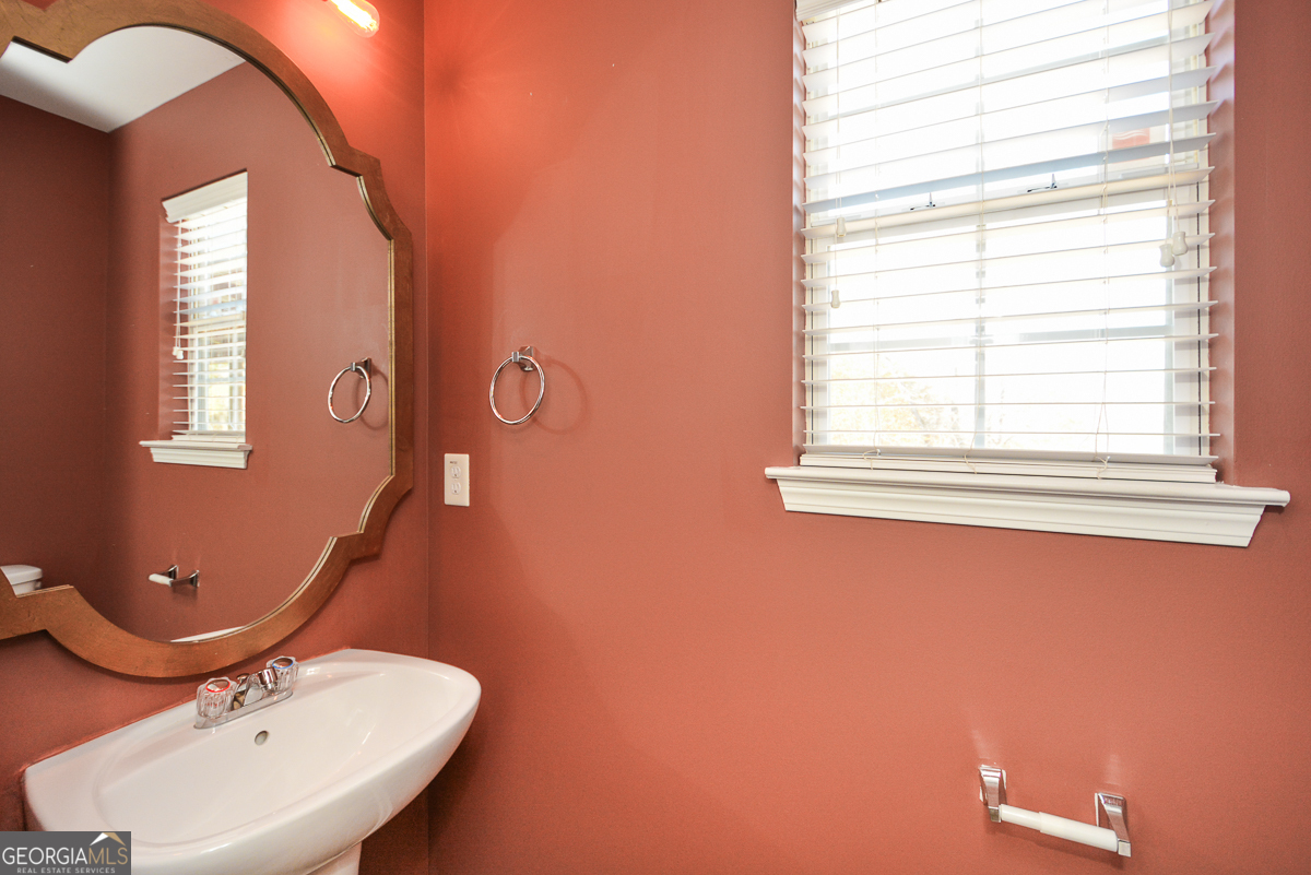 137 Baywood Crossing Hiram, GA 30141 - Photo 7 of 61 a bathroom with a sink mirror and window