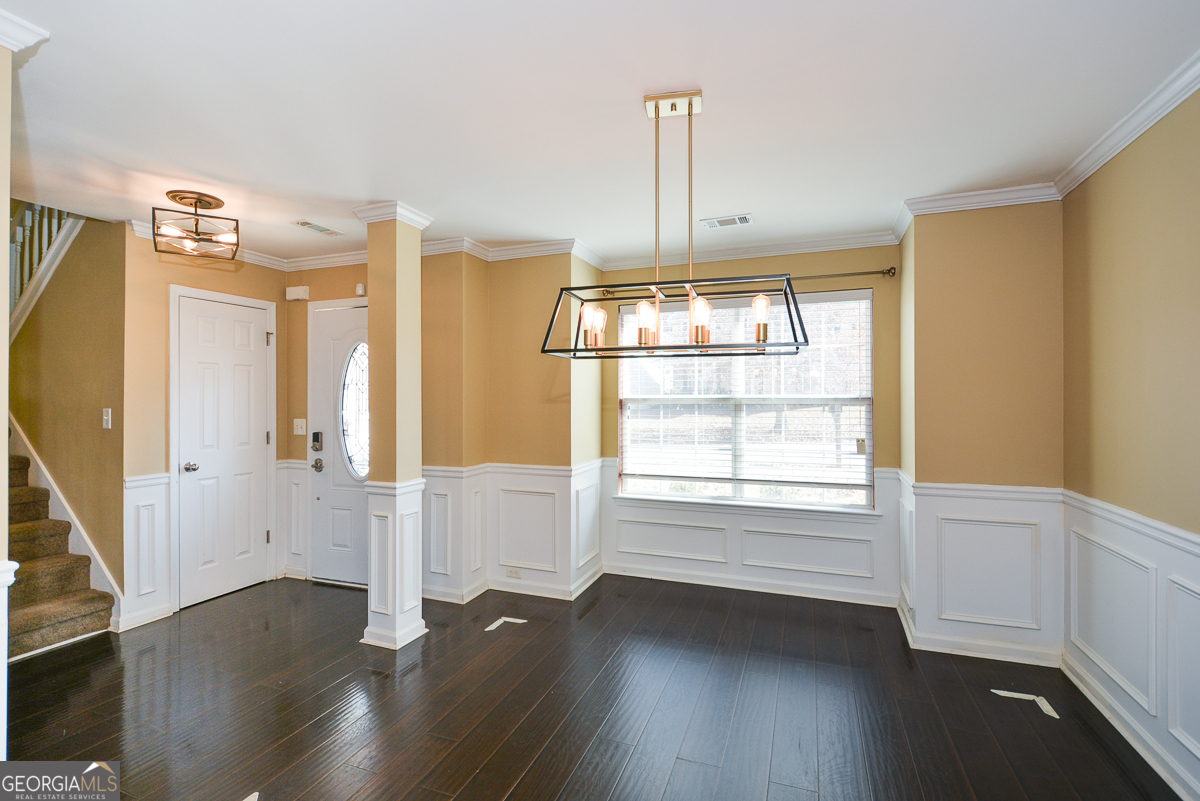 137 Baywood Crossing Hiram, GA 30141 - Photo 9 of 61 a view of empty room with wooden floor and fan