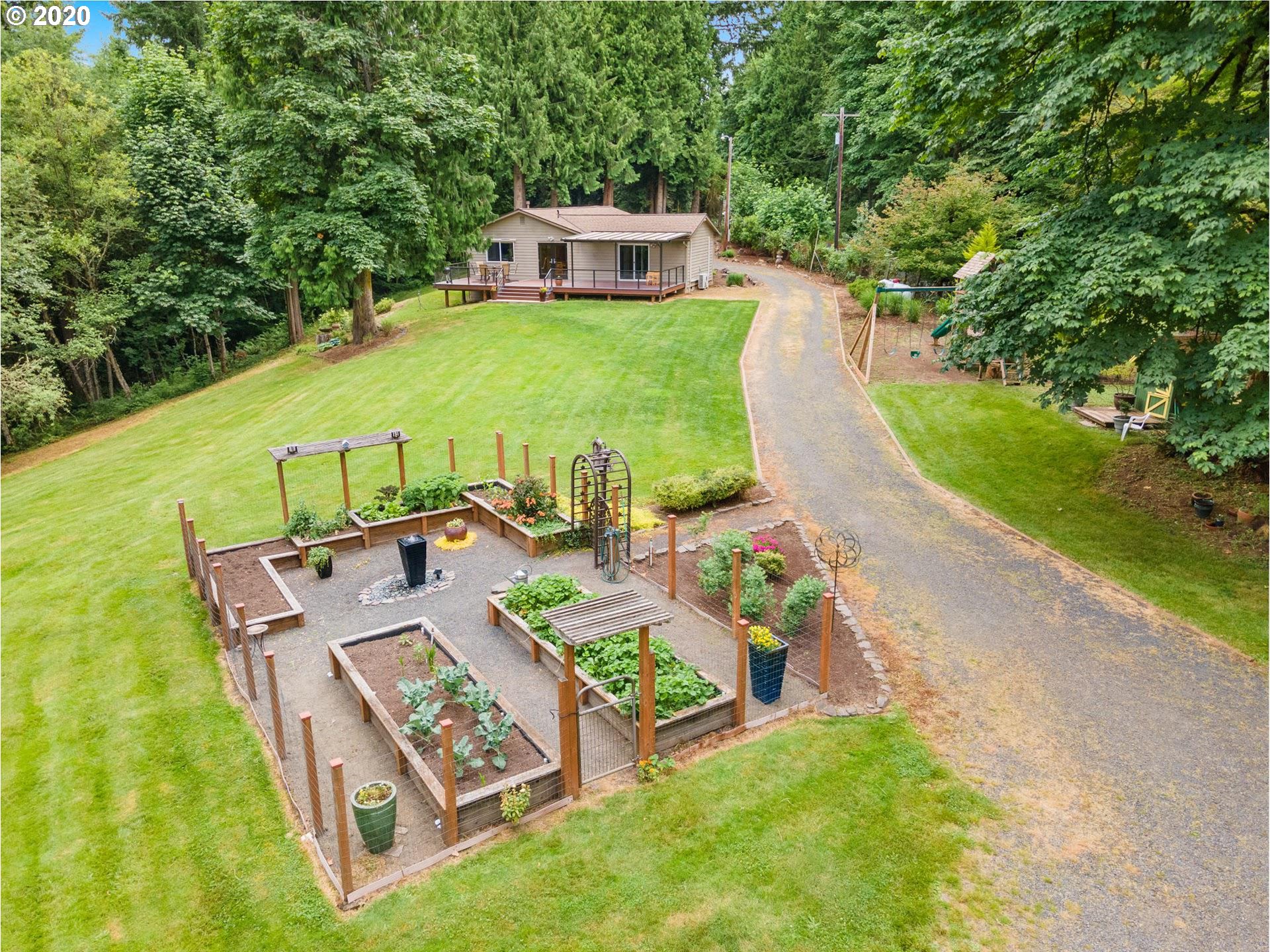 21835 Northwest Beck Road Portland, OR 97231 - Photo 3 of 32 a view of a house with pool and chairs