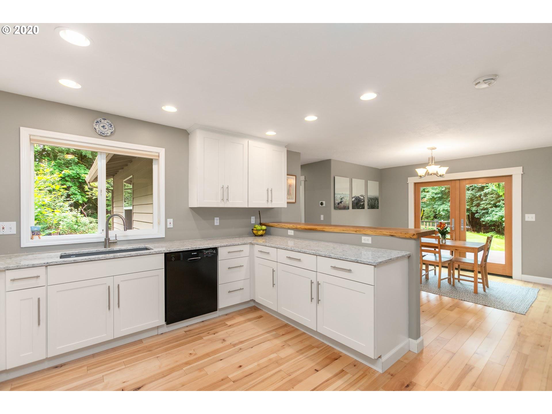 21835 Northwest Beck Road Portland, OR 97231 - Photo 8 of 32 a kitchen with a sink and cabinets