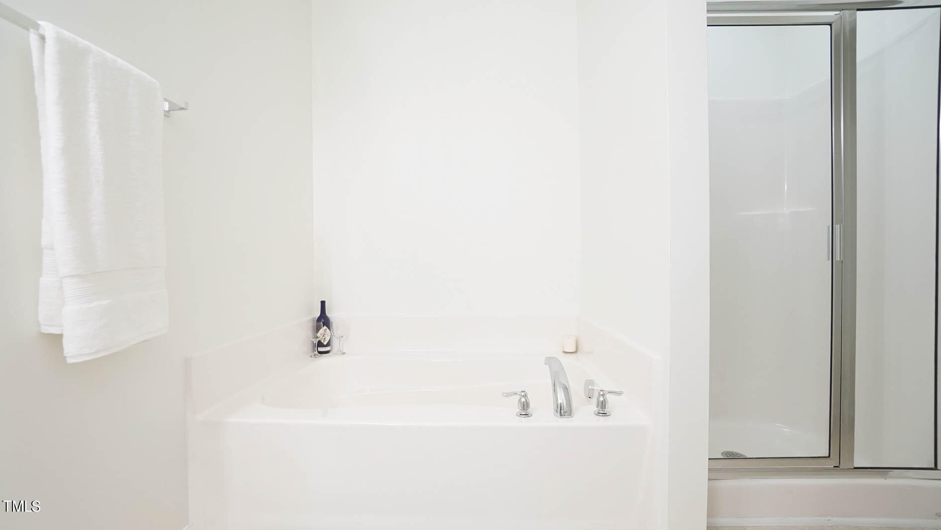 8215 Martello Lane Raleigh, NC 27613 - Photo 13 of 19 Separate garden tub and walk-in shower.