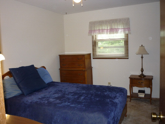 3843 Abbotsford Road Rockford, IL 61107 - Photo 4 of 8 a bedroom with a bed and a window