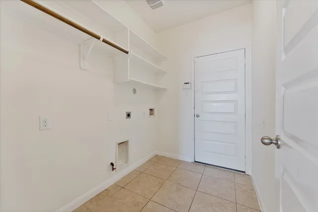 a kitchen with stainless steel appliances granite countertop a sink a stove a microwave a dining table and chairs