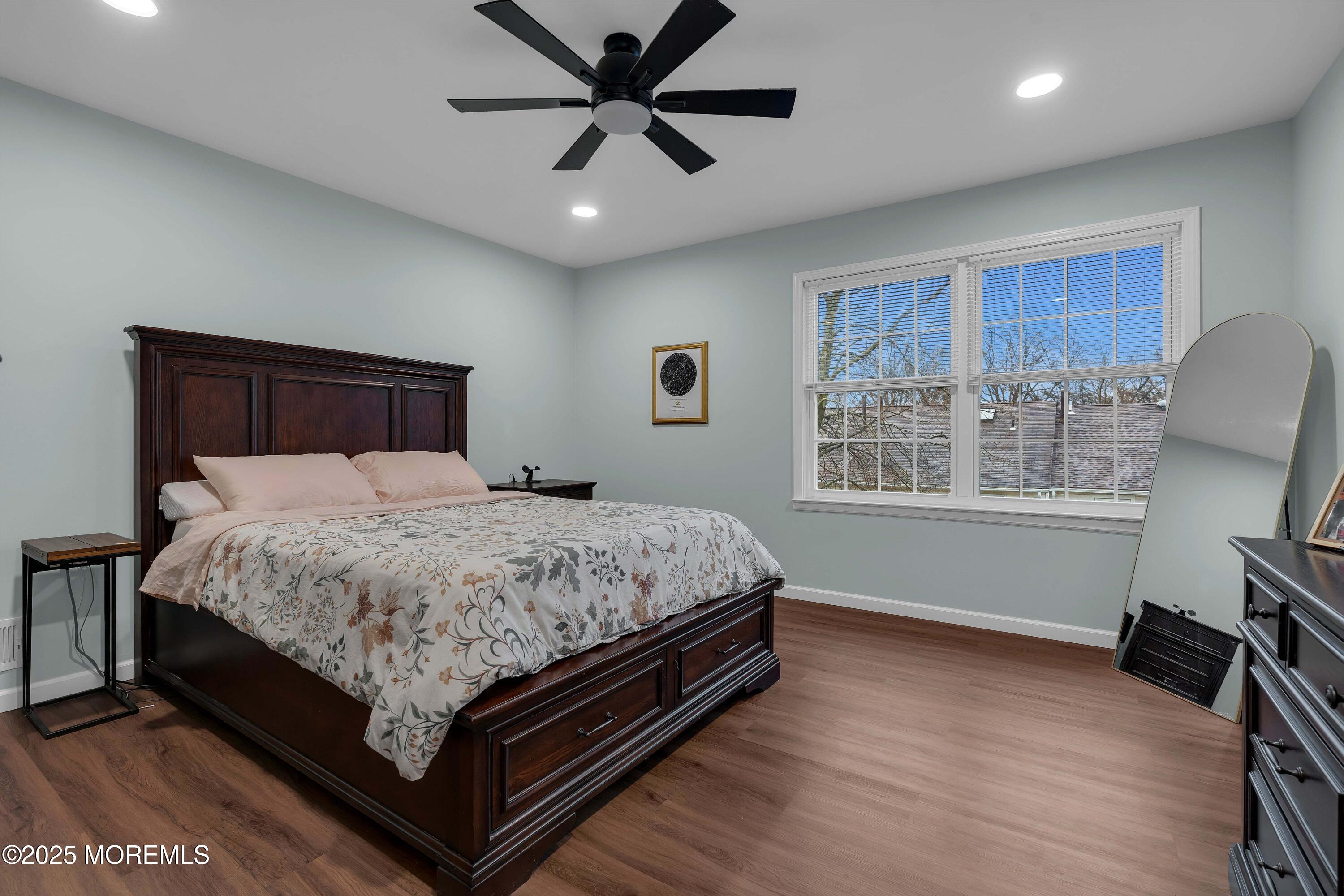 13 Dutch Lane Hazlet, NJ 07730 - Photo 20 of 28 a bed sitting in a spacious bedroom next to a window