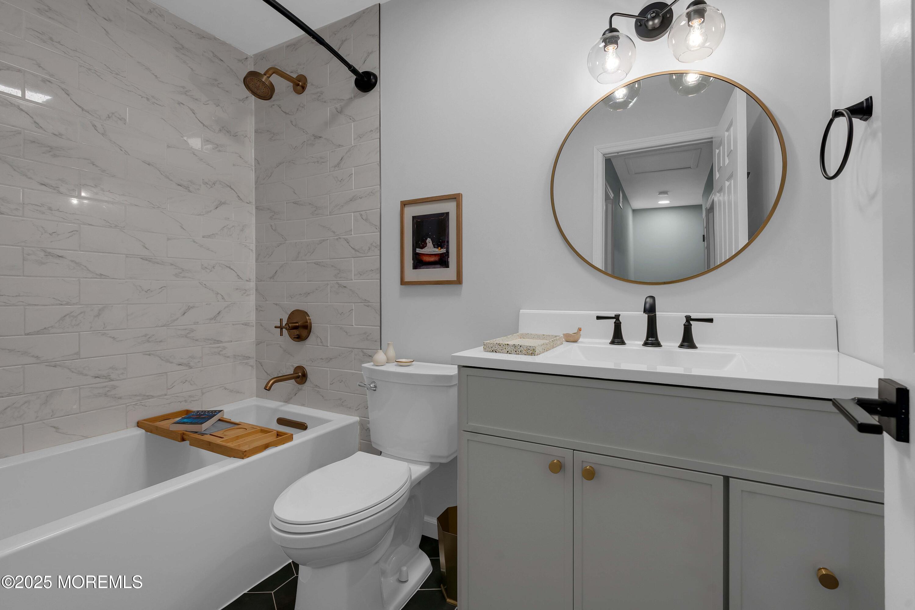 13 Dutch Lane Hazlet, NJ 07730 - Photo 22 of 28 a bathroom with a sink toilet and a mirror