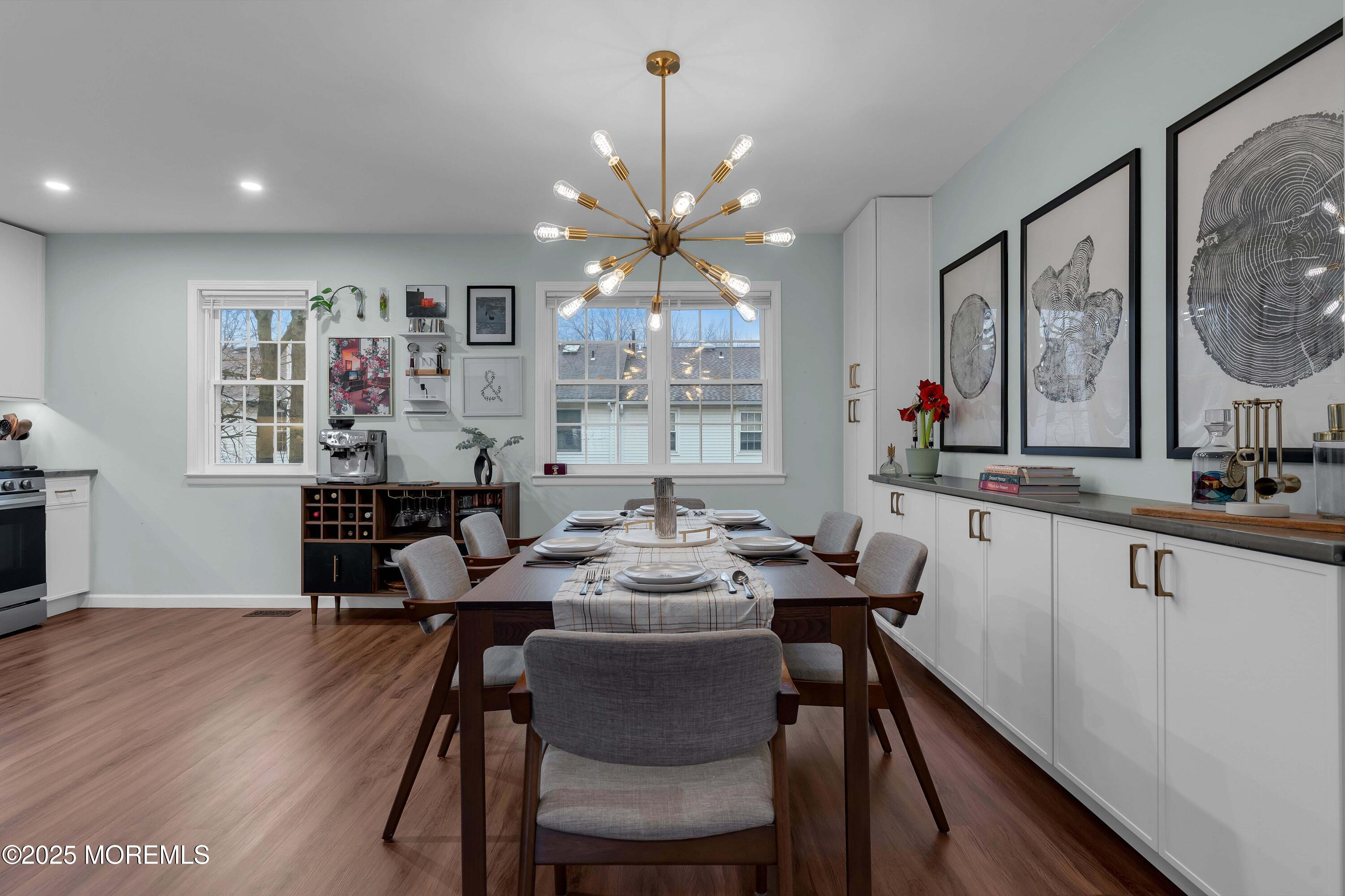 13 Dutch Lane Hazlet, NJ 07730 - Photo 10 of 28 a view of a dining room with furniture a chandelier and wooden floor