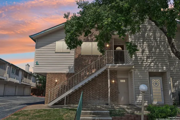 a front view of a house with stairs
