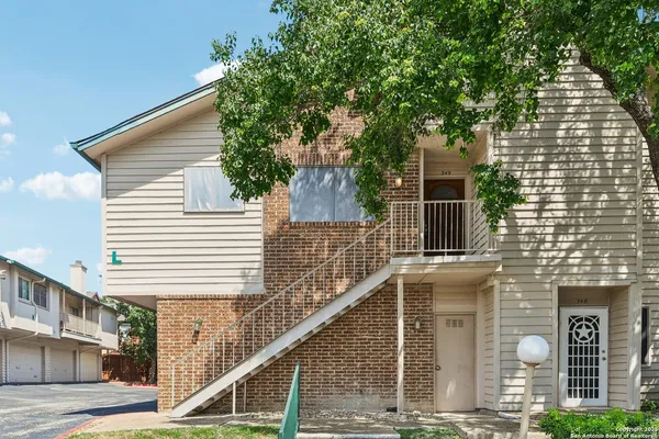a front view of a house with street