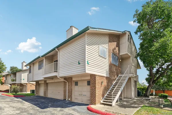 a view of a house with a street