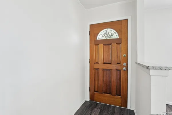 a view of entryway with wooden floor