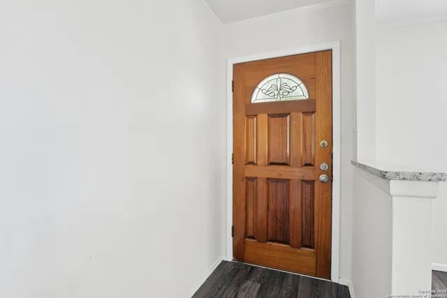 a view of entryway with wooden floor