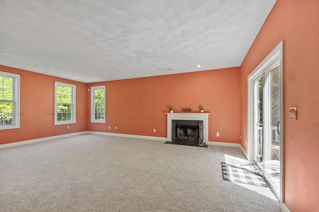 4 Forest Street Georgetown, MA 01833 - Photo 6 of 37 an empty room with fireplace and a window