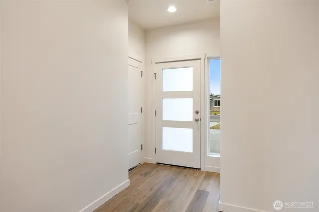 a kitchen with stainless steel appliances kitchen island granite countertop a stove a sink and a refrigerator