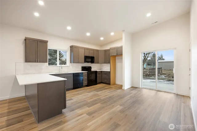 a kitchen with a sink and refrigerator