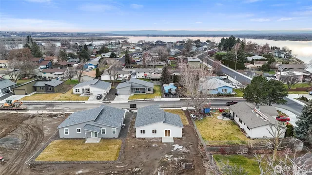 an aerial view of residential houses with outdoor space