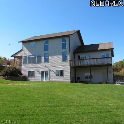 6099 Grove Road Clinton, OH 44216 - Photo 20 of 20 Back of house with private deck of Master bedroom.