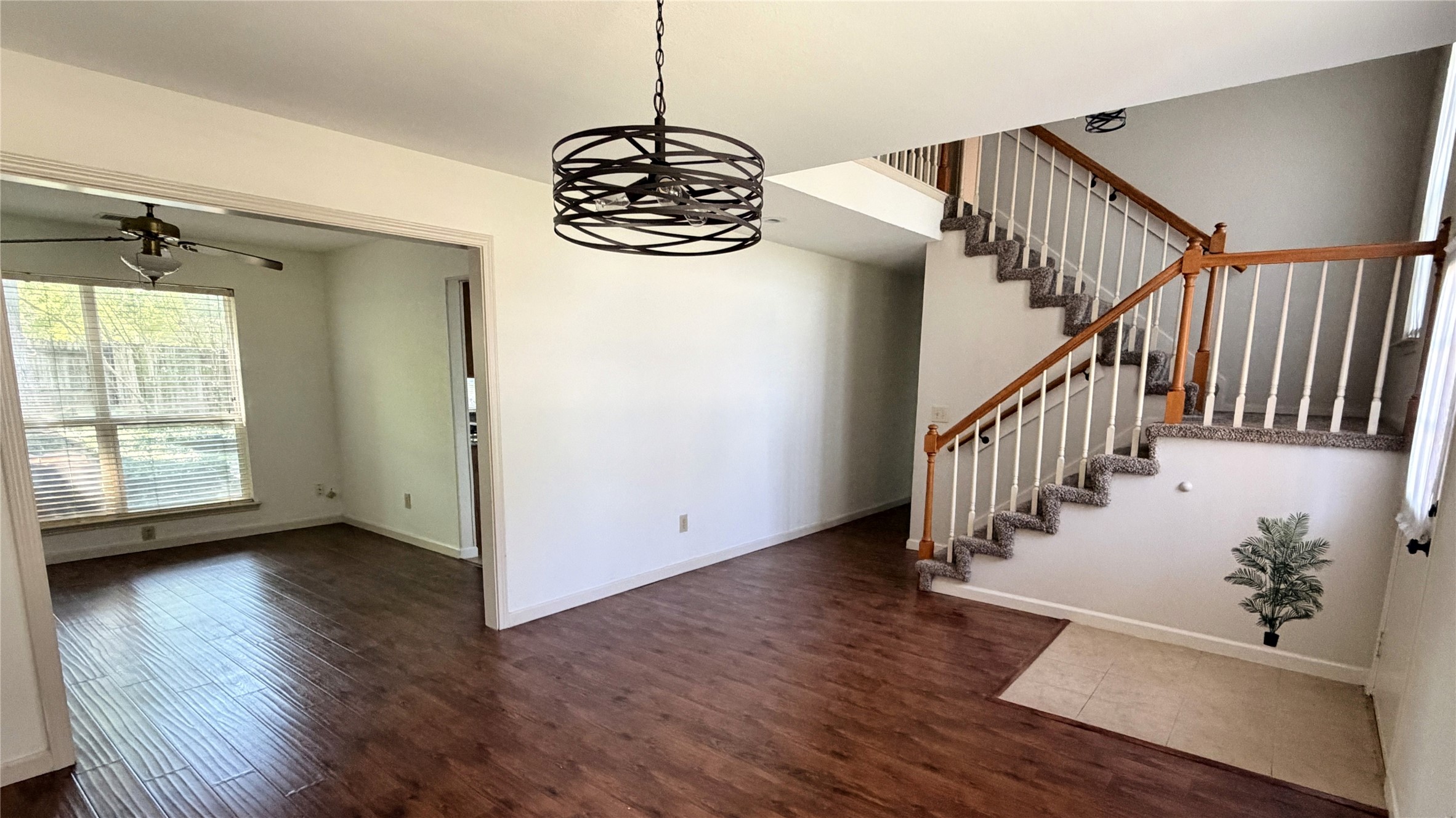 7771 Springville Drive Houston, TX 77095 - Photo 4 of 13 Spacious living area with elegant hardwood floors and versatile design.