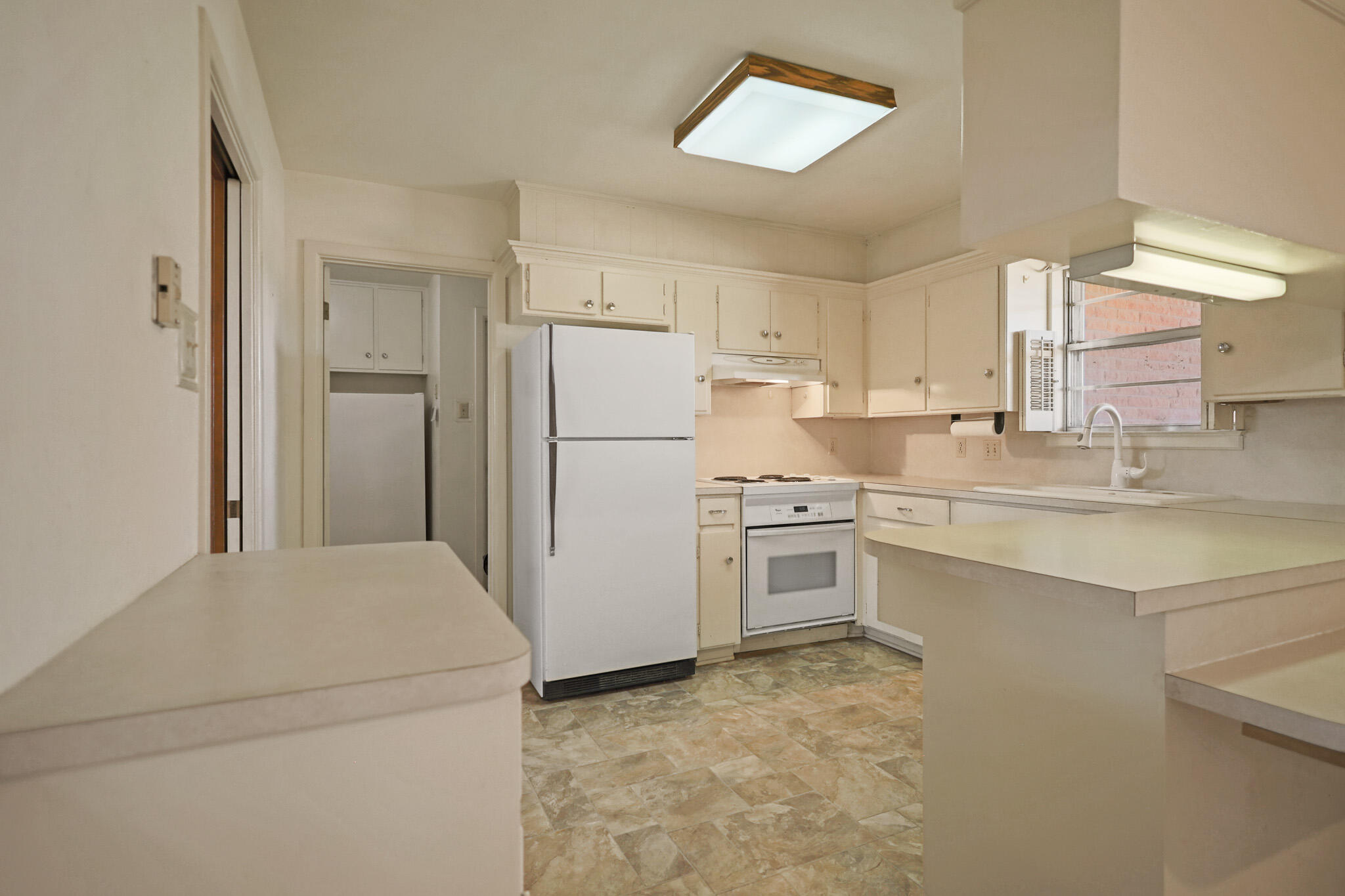 5517 26th Street Lubbock, TX 79407 - Photo 22 of 55 a kitchen with a refrigerator sink stove and cabinets