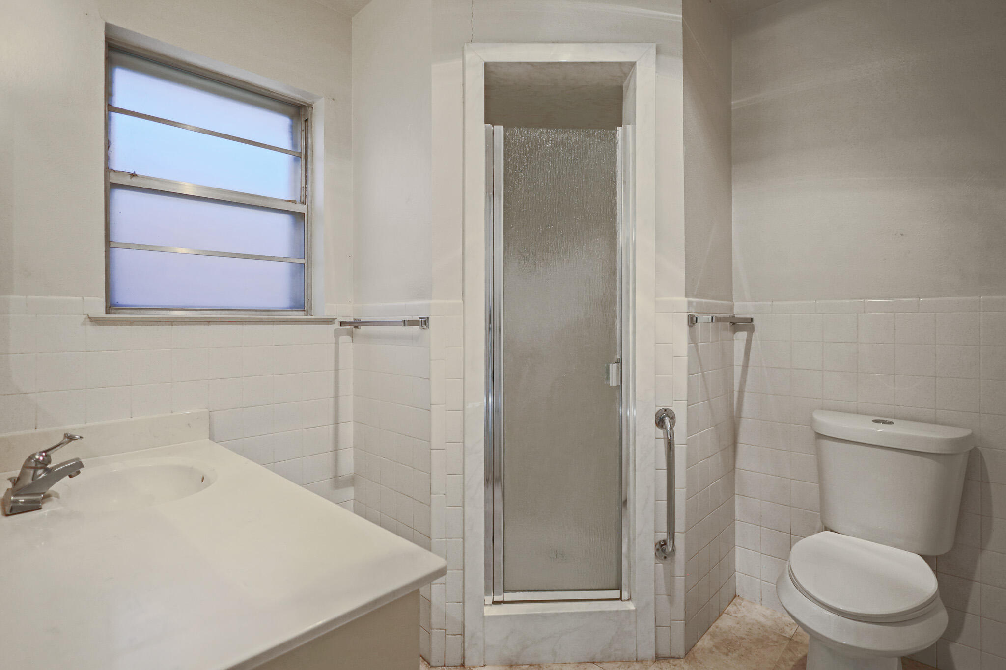 5517 26th Street Lubbock, TX 79407 - Photo 35 of 55 a bathroom with a sink a toilet and shower