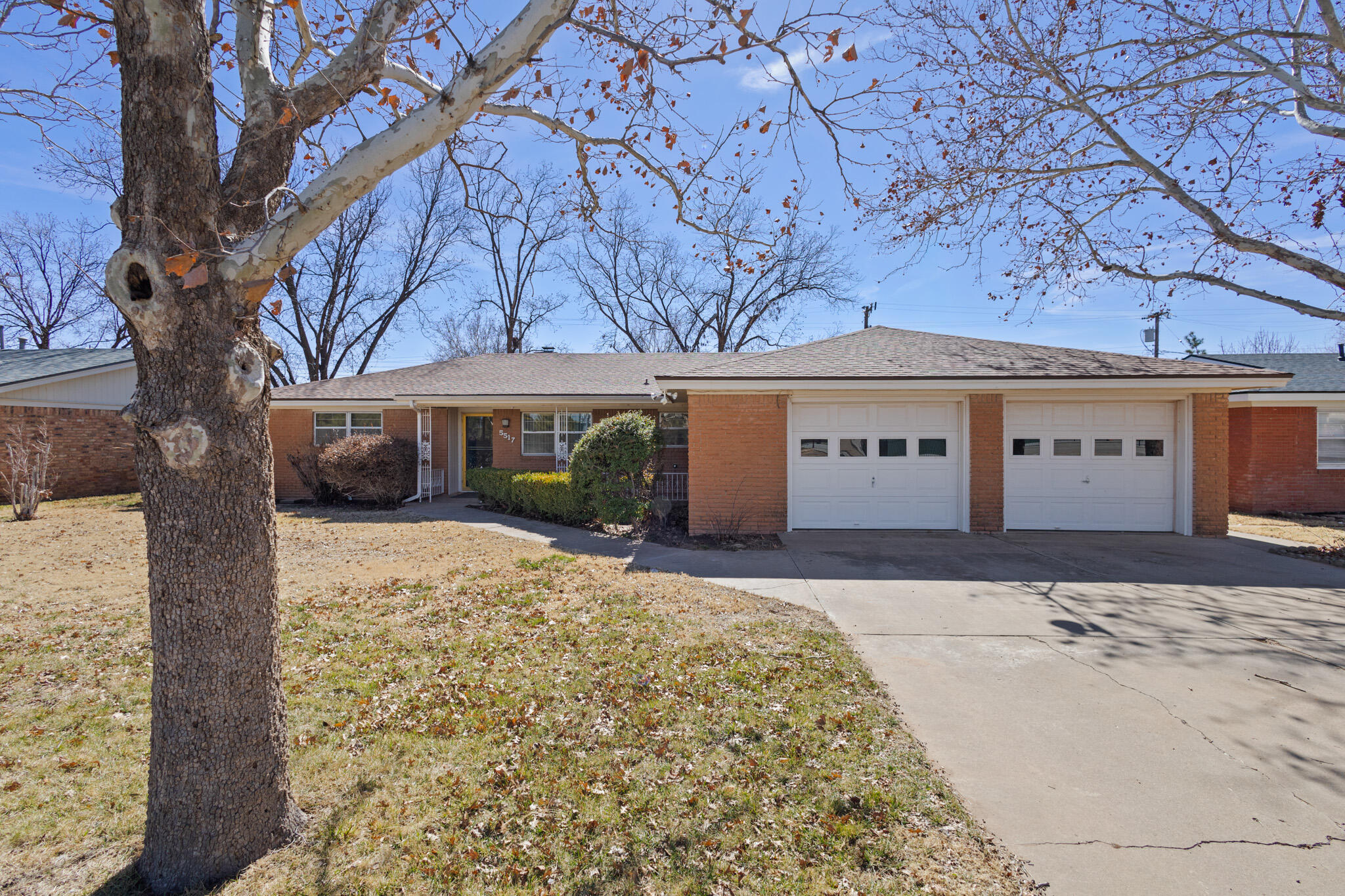 5517 26th Street Lubbock, TX 79407 - Photo 4 of 55 front view of a house with a yard