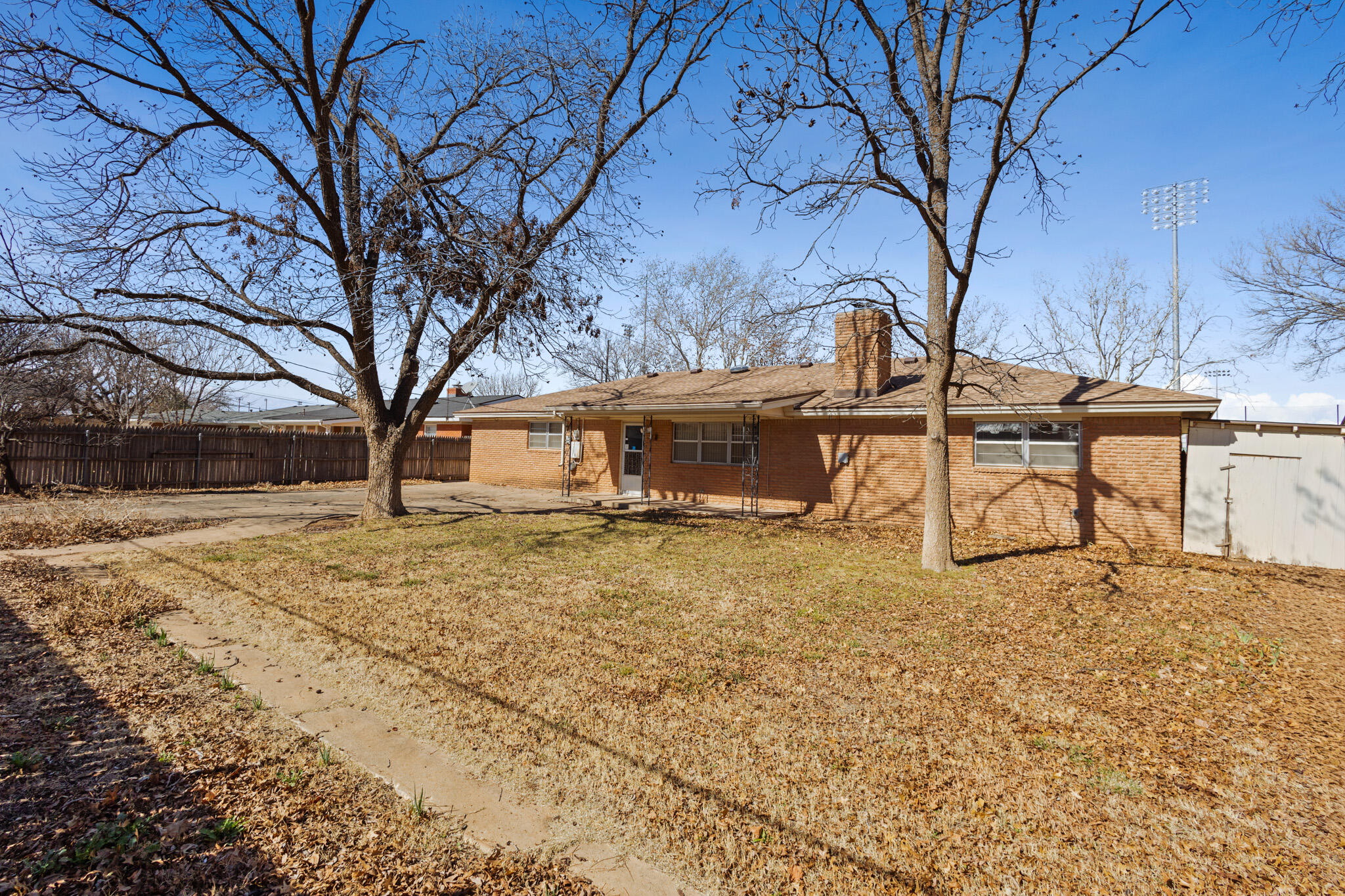 5517 26th Street Lubbock, TX 79407 - Photo 55 of 55 a view of a yard with wooden fence