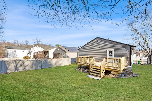 a view of a house with a yard