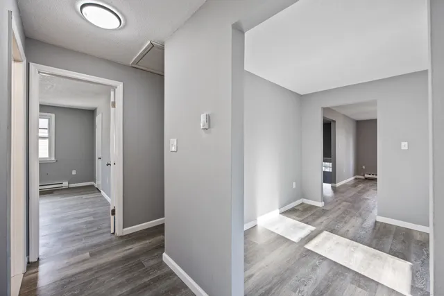 wooden floor with a cabinet in a room