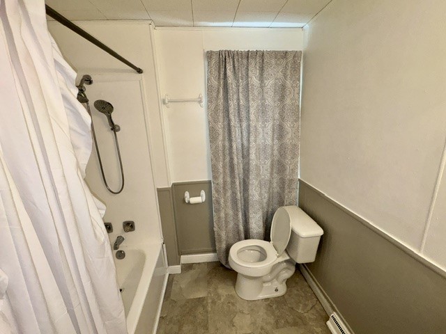 1701 West Jefferson Street Springfield, OH 45506 - Photo 14 of 18 This bathroom features a shower and toilet, offering essential amenities.