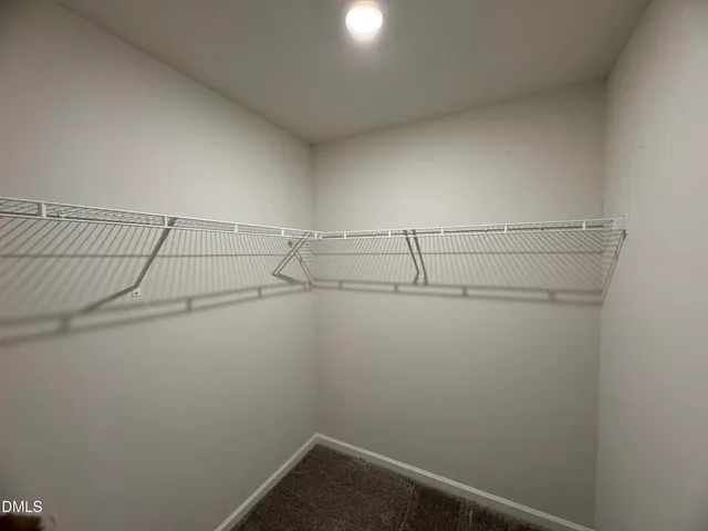a view of a room with racks on the wall