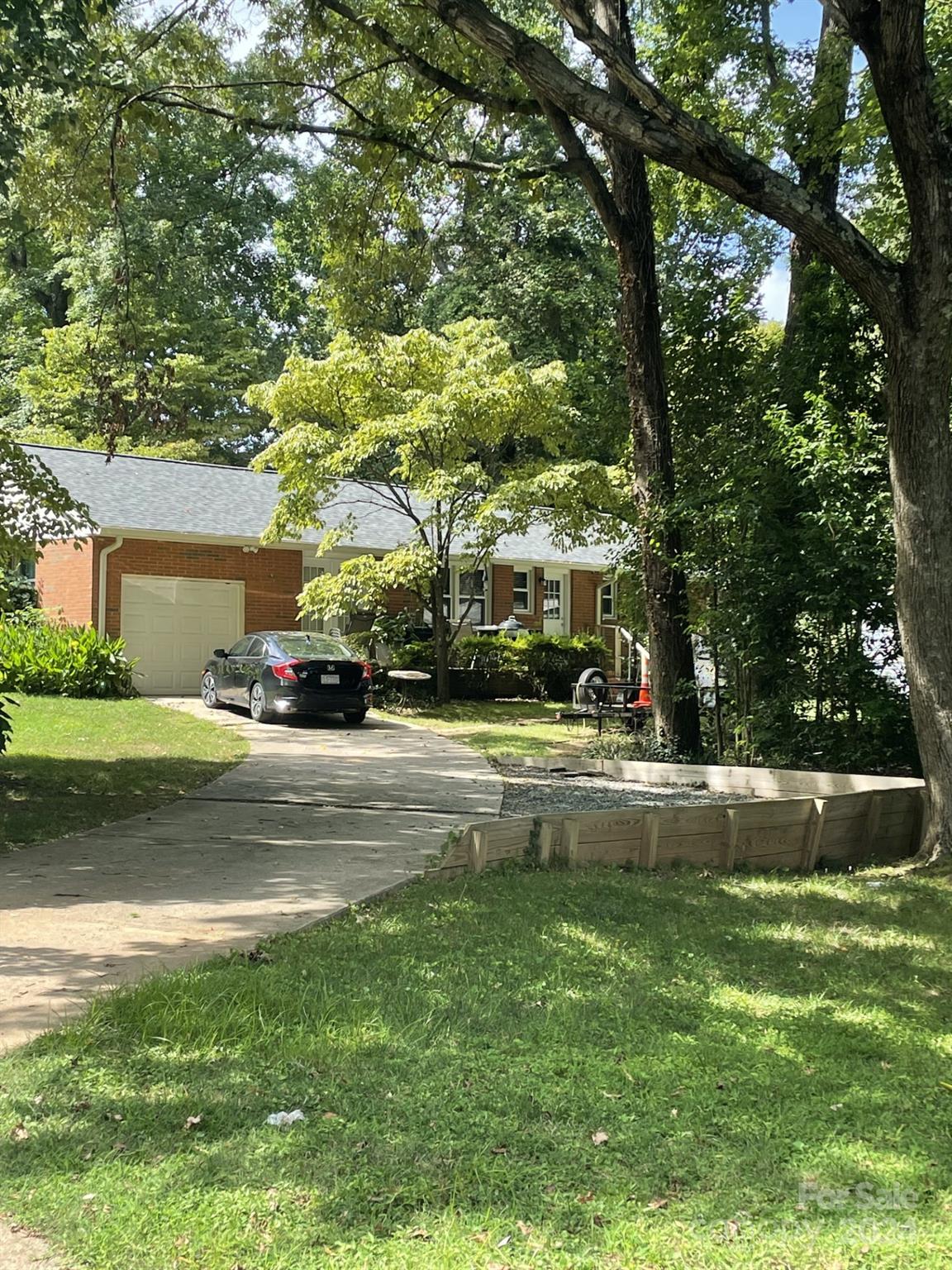 3300 Sudbury Road Charlotte, NC 28205 - Photo 2 of 2 a view of street with houses and trees