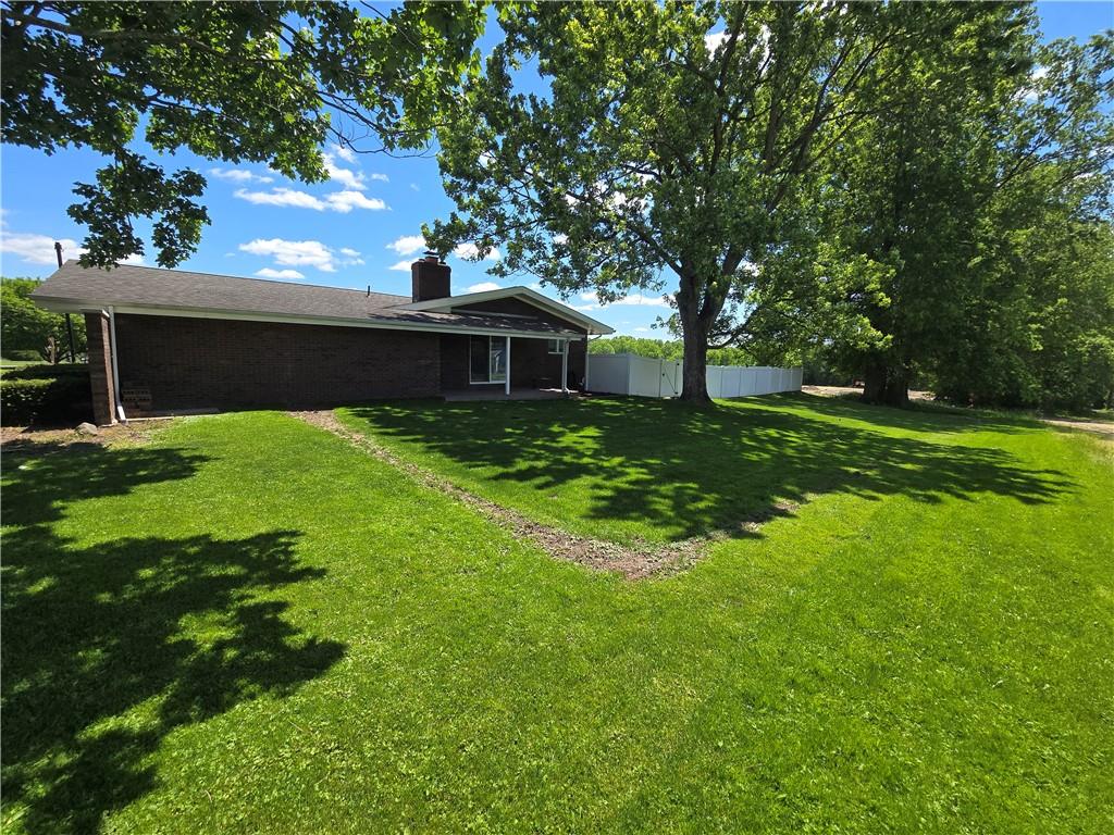 740 South Keel Ridge Road Hermitage, PA 16148 - Photo 24 of 33 a backyard of a house with plants and large tree