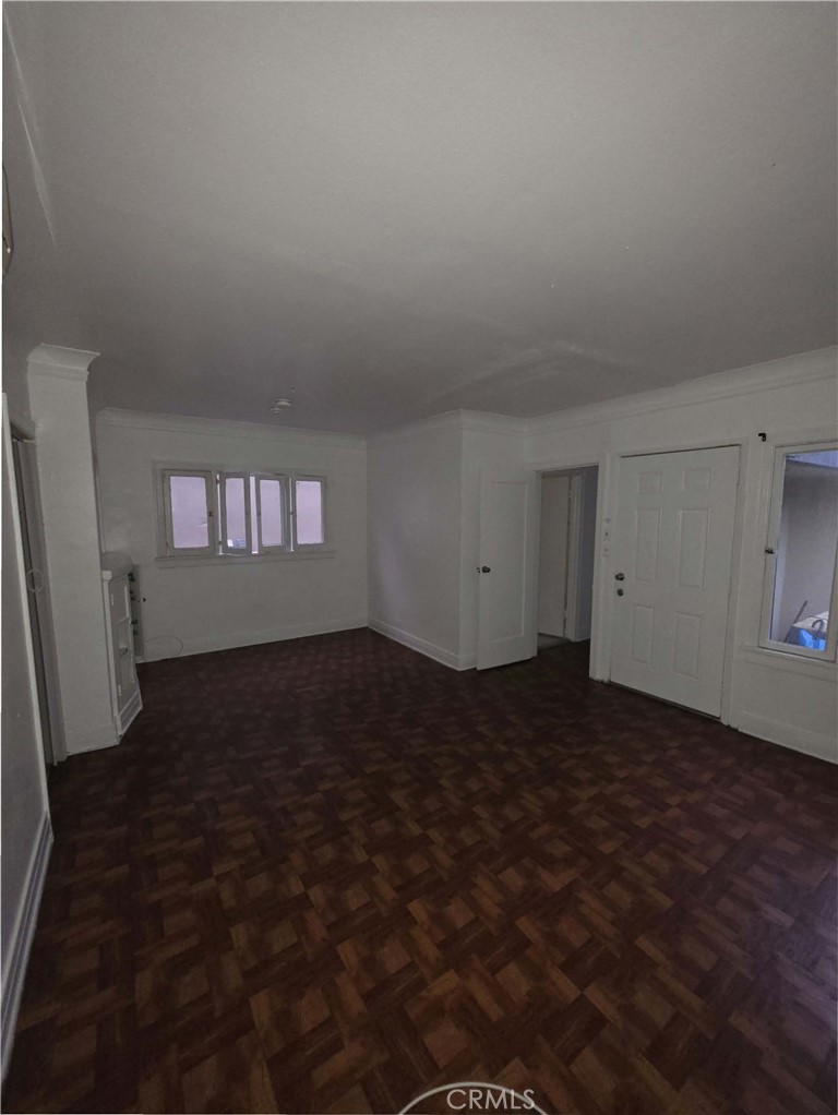 111 North Soto Street Los Angeles, CA 90033 - Photo 1 of 10 a view of wooden floor and windows in a room