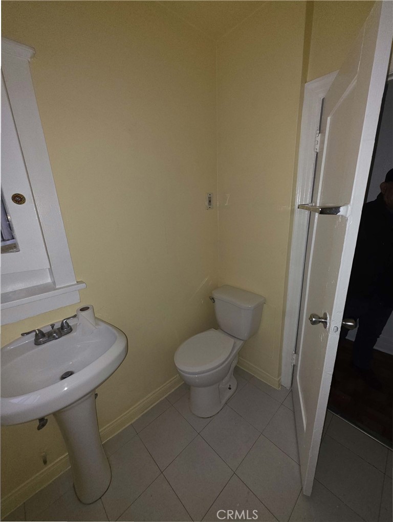 111 North Soto Street Los Angeles, CA 90033 - Photo 6 of 10 a bathroom with a toilet and a sink