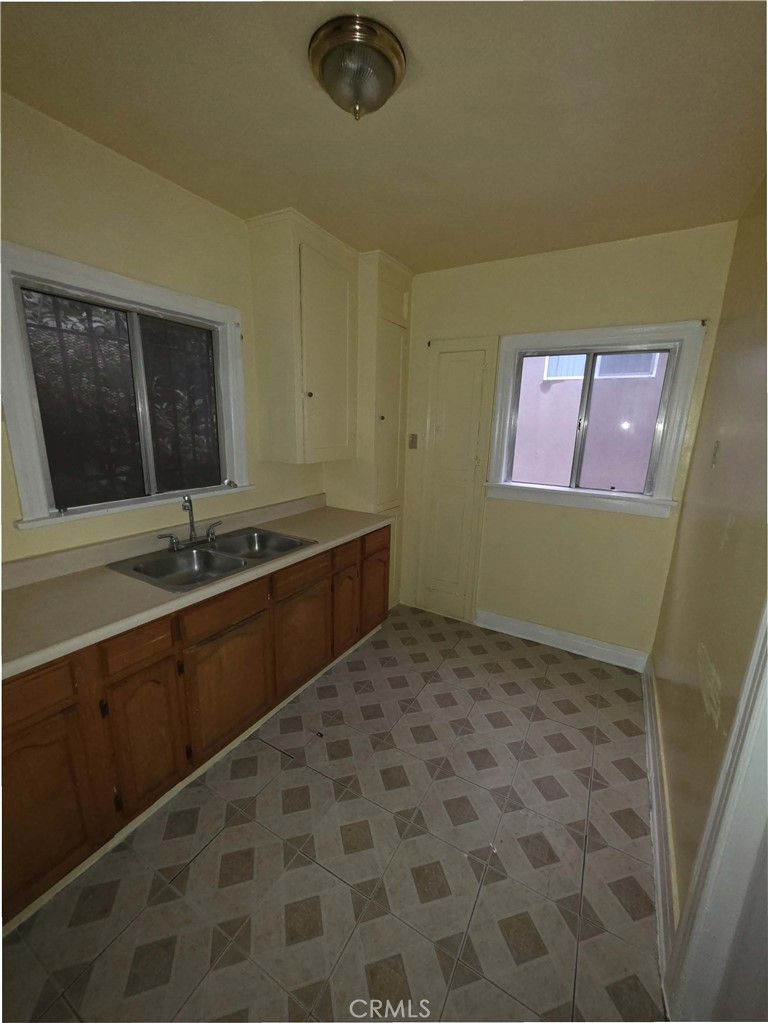 111 North Soto Street Los Angeles, CA 90033 - Photo 7 of 10 a bathroom with a sink and a mirror