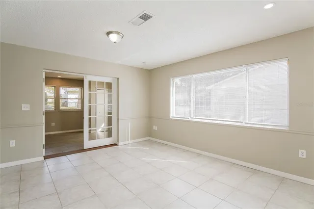 a view of an empty room with a window