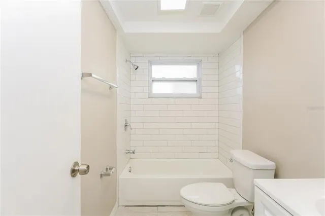a bathroom with a toilet a sink and a bathtub