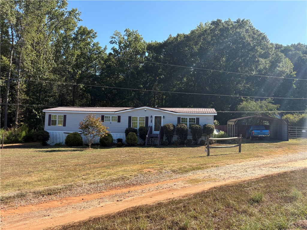 1108 Trotter Road Anderson, SC 29626 - Photo 1 of 27 Mature trees frame a peaceful country residence featuring a spacious front yard.
