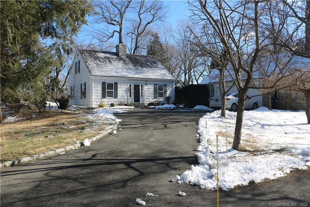 46 Ledge Brook Road Stamford, CT 06903 - Photo 1 of 1 a view of a house with snow on the side of it