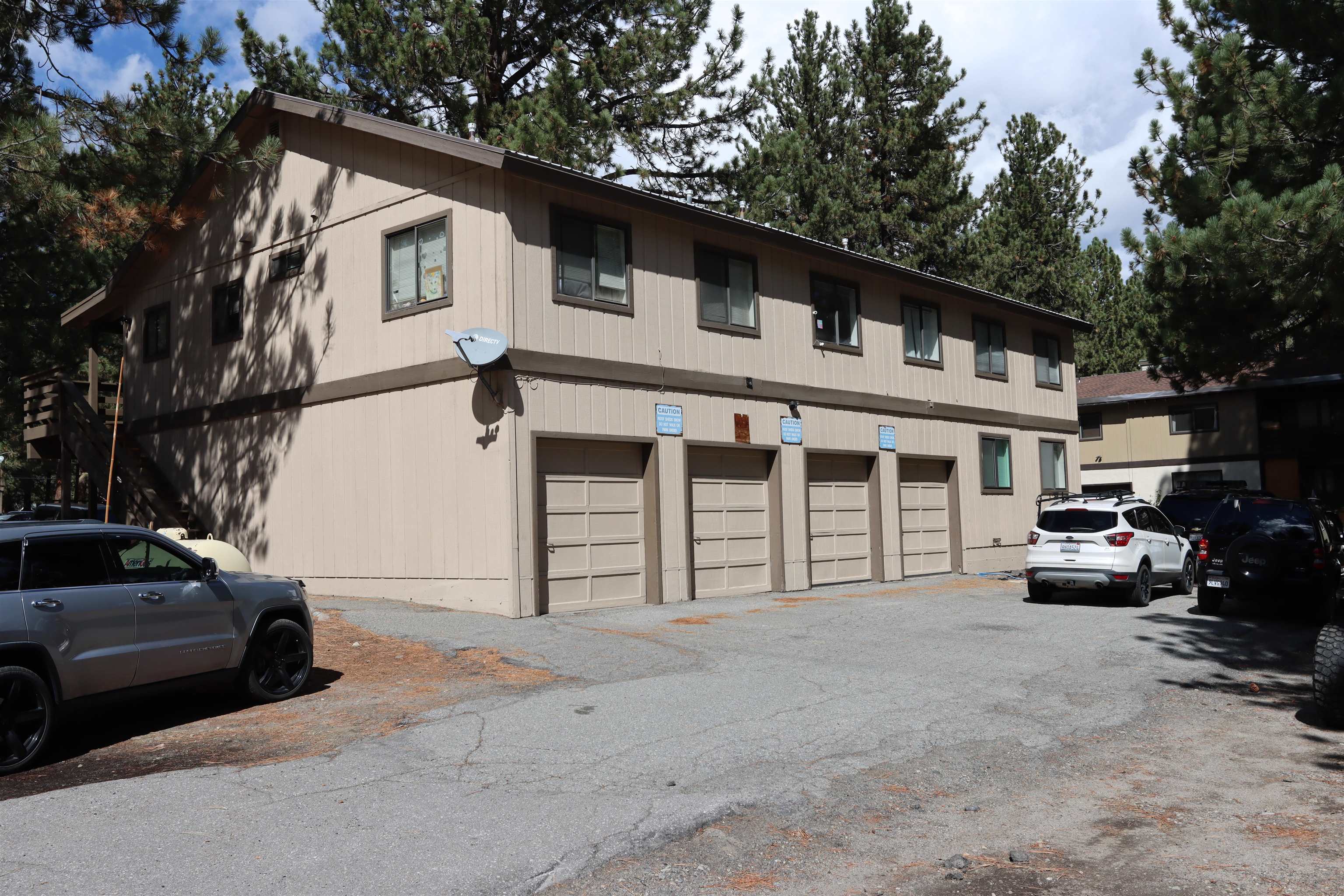 395 Chaparral Road Mammoth Lakes, CA 93546 - Photo 2 of 22 View of building exterior with a garage