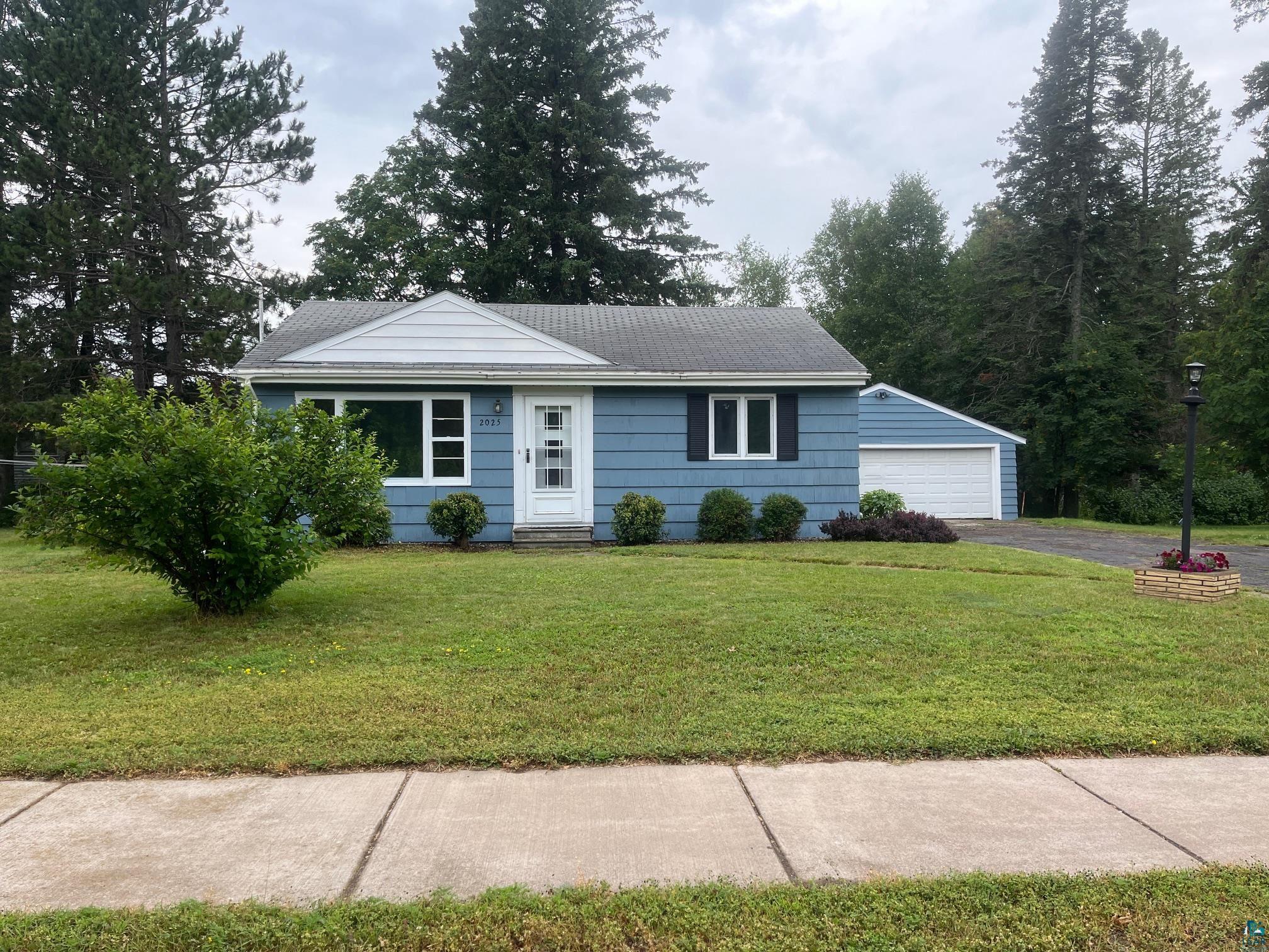 2025 Anderson Road Duluth, MN 55811 - Photo 13 of 19 Single story home with an outbuilding, a garage, and a front yard