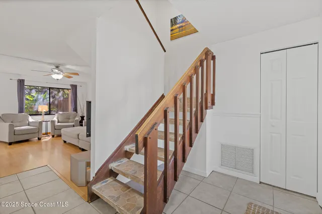 an aerial view of a house with a backyard