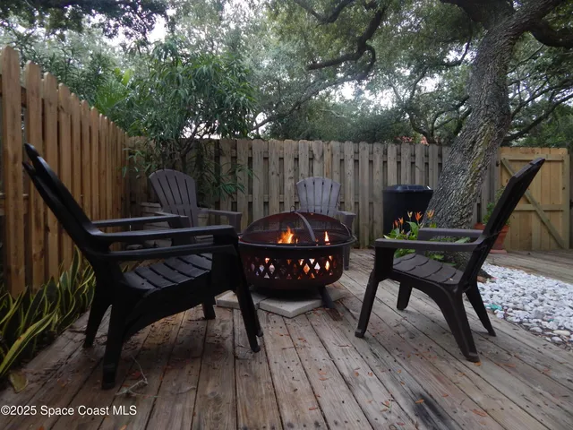 a backyard of a house with a tree