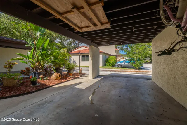 a view of front door of house with outdoor seating