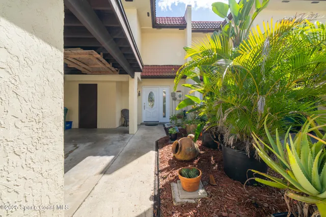 an aerial view of a swimming pool and mountain view in back