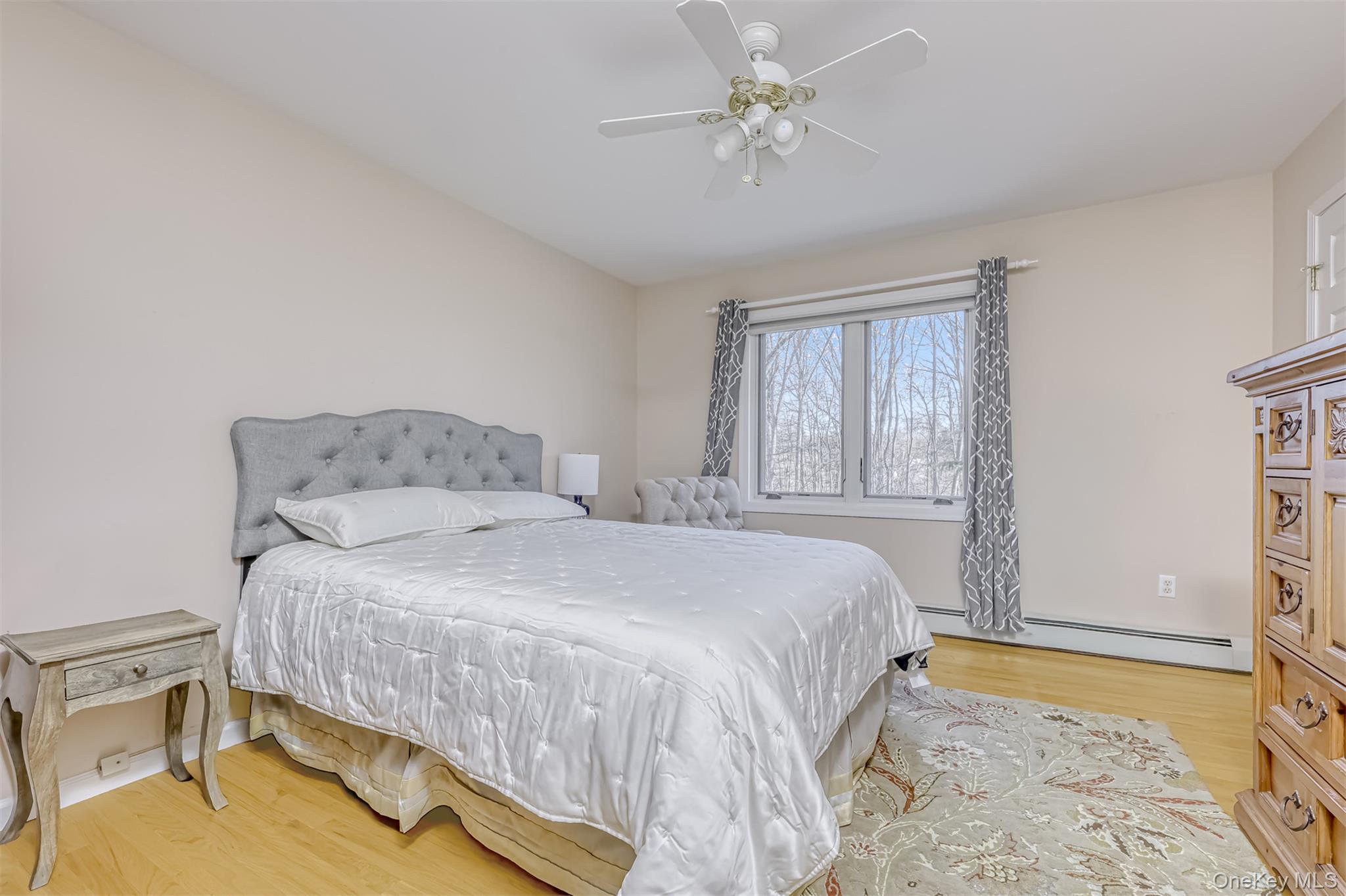 6 Wedge Way Suffern, NY 10901 - Photo 14 of 27 a bedroom with a bed chandelier and a window