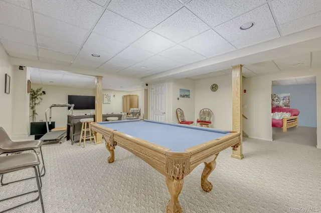 a living room with furniture and flat screen tv